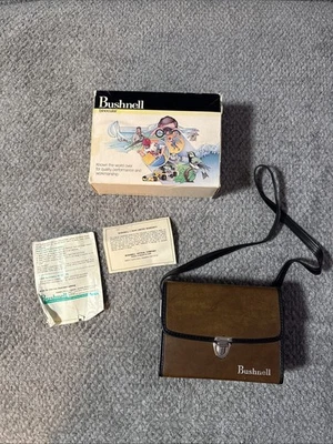 BLACK BUSHNELL INSTAFOCUS BINOCULARS Zoom 7  15 BY 35 WITH STRAPS AND CASE - Image 1 of 4