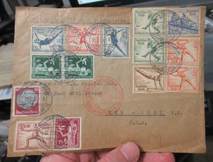 Copertina posta aerea tedesca Zeppelin 1936 per USA con francobolli e cachet olimpici - Foto 1 di 6