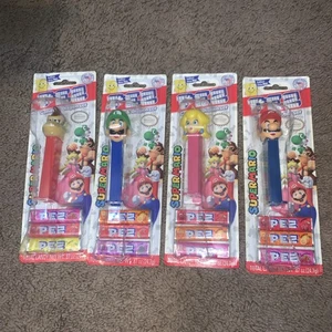 Set Of 4 - PEZ SUPER MARIO DISPENSERS SEALED / Luigi / Mario / Peach / Donkey K - Picture 1 of 2