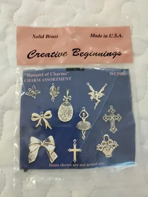 Dijes de latón Creative Beginnings (10) surtido arco bailarina cruz hada rosa  Foto 1 de 4