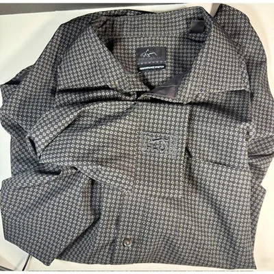 Camisa Greg Norman Performance elástica para hombre grande TPC Prestancia Foto 1 de 4