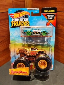 NUEVO 2023 HOT WHEELS *COMPARTIR LEONES* CAMIÓN MONSTRUO 1:64 CON COCHE TRITURADO - Imagen 1 de 14