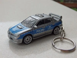 Matchbox '07 Subaru WRX Impreza Police Polizei fitted with a Keychain Keyring - Bild 1 von 2
