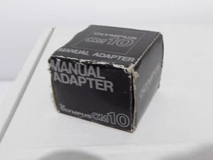 Originalverpackter Olympus OM10 manueller Adapter für analoge Spiegelreflexkamera nützlich für manuelle Steuerung - Bild 1 von 2