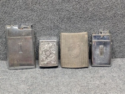 LOTE de estuches de encendedores y cigarrillos vintage Art Deco marca EVANS color plata Foto 1 de 4