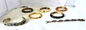 7 BRAZALETES 5 ESMALTES 2 TONOS PLATEADOS - Imagen 1 de 9