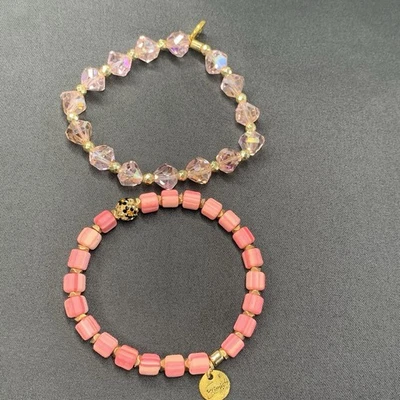 Juego de 2 Pulseras Erimish Cristales Elásticos Acabado AB Cuentas Logo Rosa Foto 1 de 4