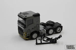 Herpa Volvo FH5 tractor unit 3-axle 6x2 yellow/gray/black 1:87 /H23971 - Picture 1 of 1