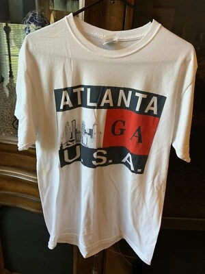 Shirts For Teens, 3-1 White Atlanta, 1 Blue ‘Wild Child”, 1 Grey “the Demoorgi” - Image 1 of 4