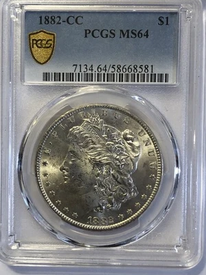 1882-CC PCGS MS-64 MORGAN SILVER DOLLAR, GOLD SHIELD - Image 1 of 4