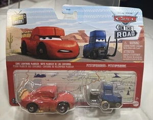 Pixar Cars Metal Series On The Road 2 Pack Cave McQueen & Pistopsaurus NEW 2023 - Picture 1 of 5