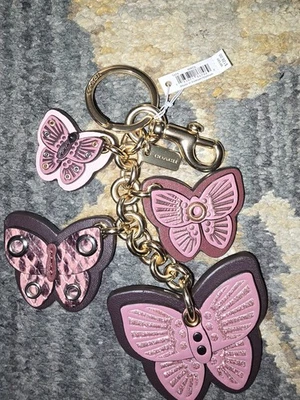 Bolso Coach Butterfly Cluster Dije Nuevo con Etiquetas Color Rosa Polvoriento Foto 1 de 3