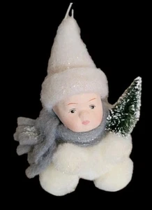 VINTAGE PORCELAIN FACE SNOW BABY ORNAMENT HOLDING A BOTTLE BRUSH CHRISTMAS TREE - Picture 1 of 3