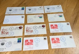 1974 - 77 12 UNITED NATIONS STAMPED Envelopes / Postcards from INPEX - Picture 1 of 13