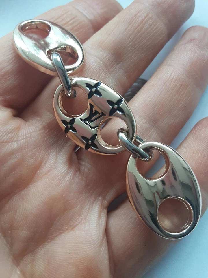 Un conector oro y negro colgante encanto cremallera tirador Foto 1 de 3