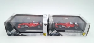 2 Hot Wheels Racing 1/43 Ferrari F2004 + F2005 MICHAEL SCHUMACHER  Mattel G9731 - Foto 1 di 3