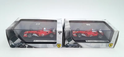 2 Hot Wheels Racing 1/43 Ferrari F2004 + F2005 MICHAEL SCHUMACHER  Mattel G9731 - Immagine 1 di 3