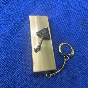 Vintage A GOLD TONE PRODUCT Sliding Keychain Box w/ Umbrella And Bonnet. B5 - Picture 1 of 9
