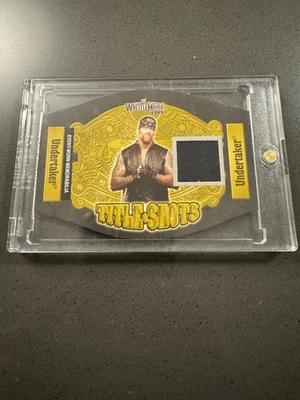 WWE UNDERTAKER 2003 WRESTLEMANIA FLEER TITLE SHOTS EVENT USED SHIRT RELIC CARD - Image 1 of 4