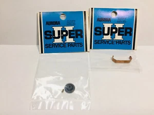 AURORA AFX SUPER II CLUSTER GEAR & SHAFT / PLATED GEAR CLAMP~ NEW~ $7.99 start - Foto 1 di 3