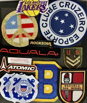 Mixed Lot Of 12 Patches Lakers US Army US Coast Guard Bruins Peace Rockstar NOS - Image 1 of 4