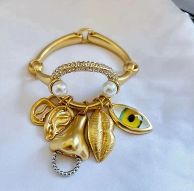 Schiaparelli Surrealist Charm Facial Collection Pendant Gold Tone Bracelet - Image 1 of 4