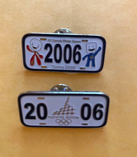 JUEGO DE 2 PINES TORINO OLYMPICS PLACAS MASCOTAS BOLA DE NIEVE NEVE CUBO DE HIELO BRILLO NUEVO Foto 1 de 1