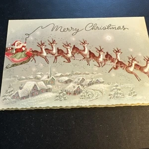 Tarjeta de Navidad de colección Papá Noel frente solo Mcm brillo trineo volador reno sobre la ciudad - Imagen 1 de 6