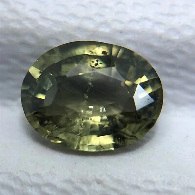 Verbal Certified 0.70 CT Natural Kornerupine Yellowish Green  Oval Cut Gemstone - Image 1 of 4
