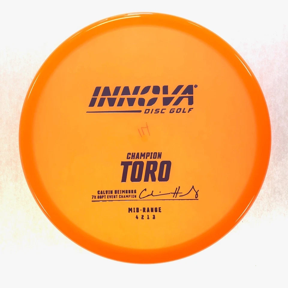 DISC GOLF INNOVA CHAMPION TORO MID-RANGE 171g ORANGE CALVIN HEIMBURG - Image 1 of 1