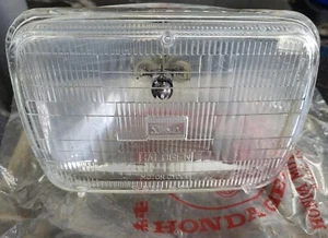 UNIDAD DE FAROS HONDA 12V 65/45W 33120-MB0-671 '82 VF750S nuevo de fábrica original - Imagen 1 de 2
