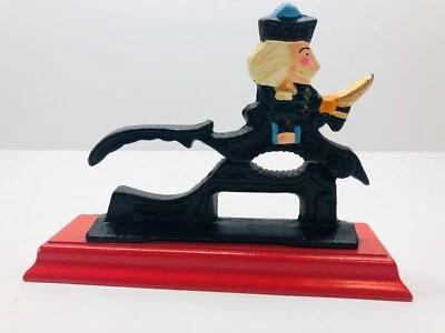Cast Iron Nutcracker On Red Wood Base - Image 1 of 4