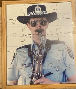 Police Man Playing The Saxophone 20 Piece Wooden Jigsaw Puzzle - Picture 1 of 2