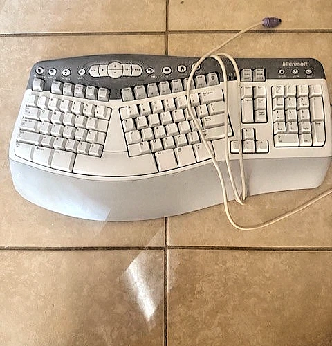 MICROSOFT ERGONOMIC KEYBOARD GREY & WHITE TONES. P2 CONNECTION. GOOD SHAPE - Image 1 of 1