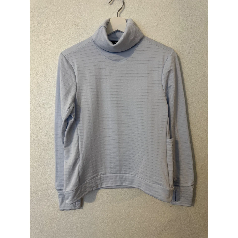 Camiseta para correr Nike Therma Fit azul claro cuello alto manga larga Foto 1 de 4