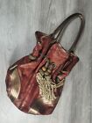 Handbag  With Lovely Design And Tassles By Pomegranate
