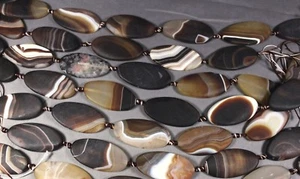 MATTE BANDED BROWN AGATE 50X25MM OVAL TWIST BEADS KNOTTED 16" STR (7 BEADS) - Picture 1 of 1