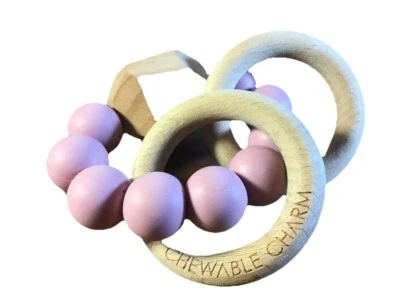 Mordedor masticable de silicona y madera Foto 1 de 2