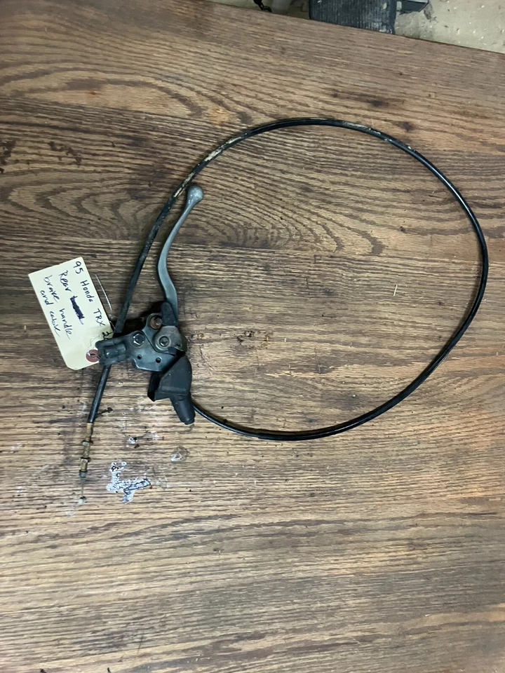 Manija y cable freno de mano trasero Honda Fourtrax TRX 200 tipo 2 91 92 93 94 95 Foto 1 de 1