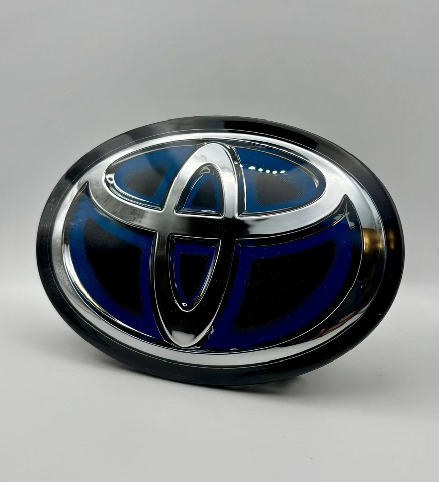 Toyota RAV4 Front Emblem Blue Hybrid 53141-33130 Grille Logo 2019–2025 - Image 1 of 4
