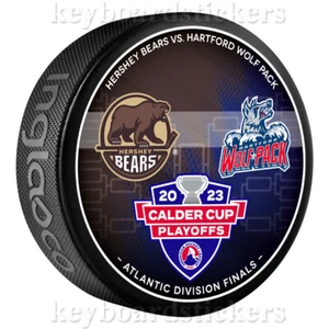 2023 AHL Calder Cup Playoffs Dueling Puck Hershey Bears vs Hartford Wolf Pack - Bild 1 von 2
