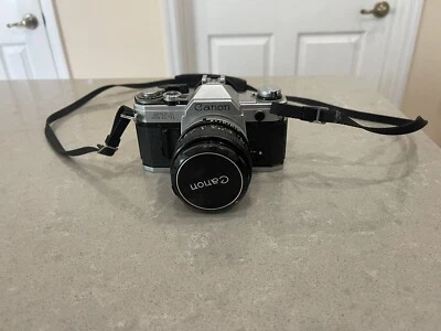 Cámara de película Canon AT-1 plateada SLR de 35 mm de colección con lente SSC de 50 mm 1,4 Foto 1 de 4