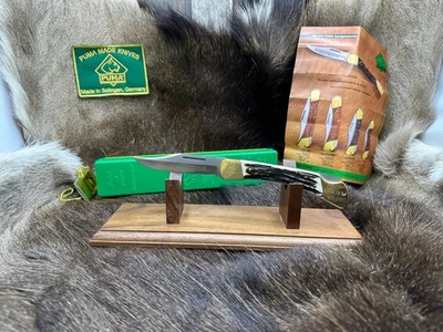 Cuchillo Puma Grabado Prince 1976 4 7/8" Lockback con asas de ciervo como nuevo caja A Foto 1 de 4