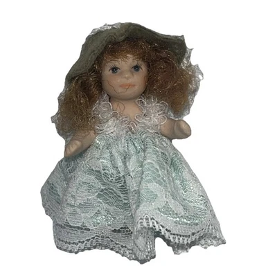Miniature Dollhouse Porcelain Little Girl Toddler Doll Green Dress 2.5" - Image 1 of 4