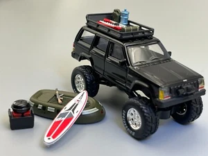 Jeep Cherokee XJ Bigfoot Rock Crawler PopRace 1/64 Scale with Accessories - Picture 1 of 19