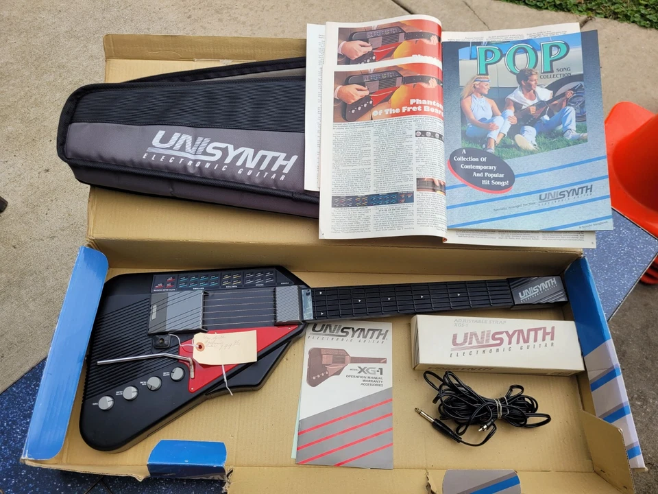 Suzuki Unisynth XG-1  Synthesizer Electric Guitar Original Songbook Case Strap  - Image 1 of 4