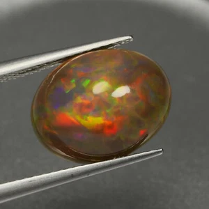 3.77Ct Perfect Oval 13.2 x 10.3 MM 100% Natural Black WITH Multi Color Fire Opal - Picture 1 of 5
