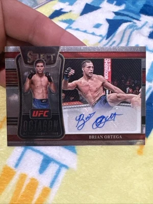 2022 Panini Select UFC Octagon Action Signatures Brian Ortega #OA-BOT Auto - Image 1 of 2
