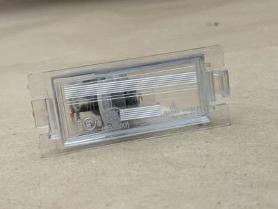 OEM 2007-2012 Dodge Caliber LH lado izquierdo matrícula luz lámpara con bombilla 809280 Foto 1 de 4