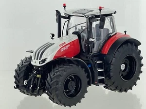 MODELL TRAKTOR STEYR 6340 TERRUS CVT TRECKER SCHLEPPER SCHWARZE FELGEN 1:32 LMTD - Bild 1 von 2